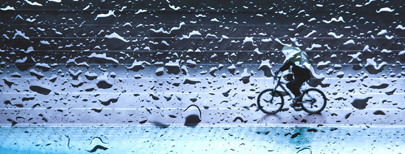Cyclist in the rain. Blog about python scraping data from wunderground rainfall data.